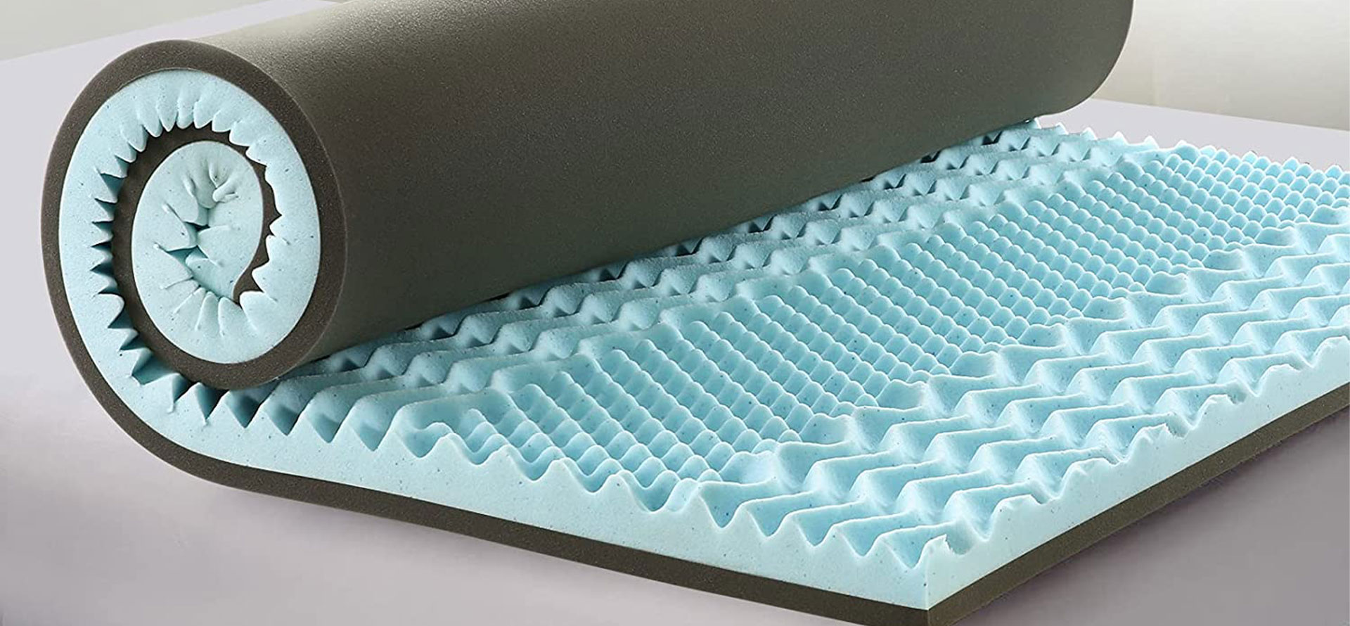 Cooling mattress topper on a bed. 