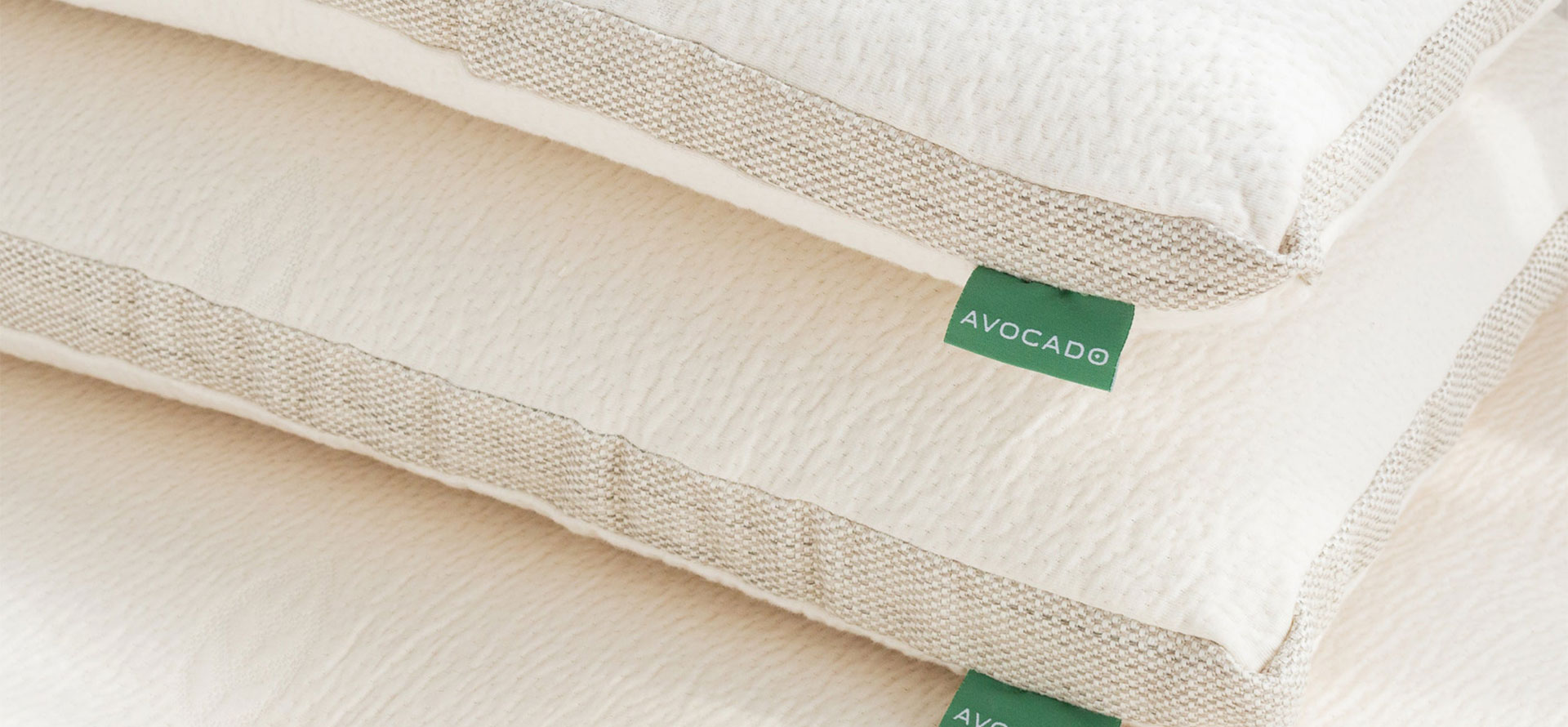 Avocado pillows on mattress.