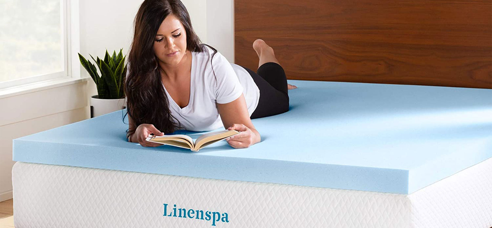 Linenspa mattress women on bed.