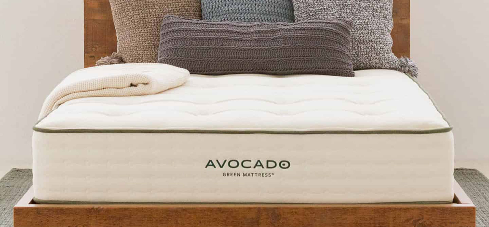 Avocado mattress on bed.