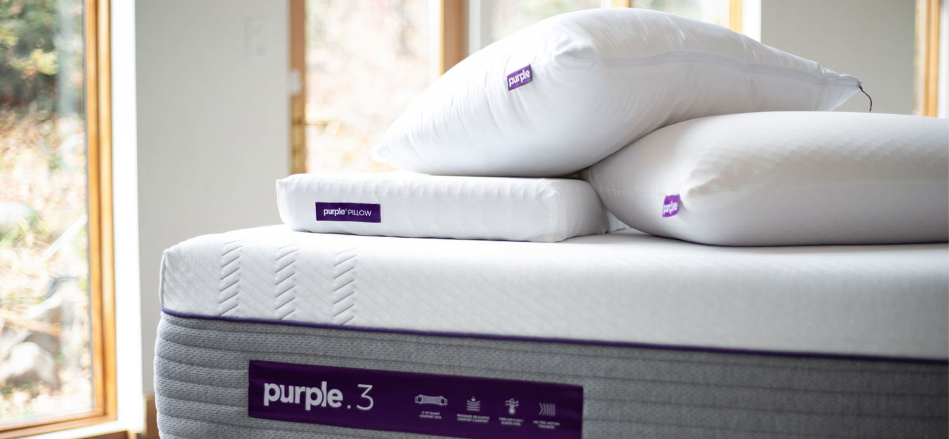 Purple pillow on mattress.