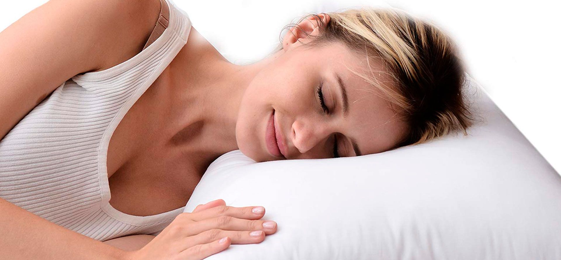 A woman sleeping on a down alternative pillow.