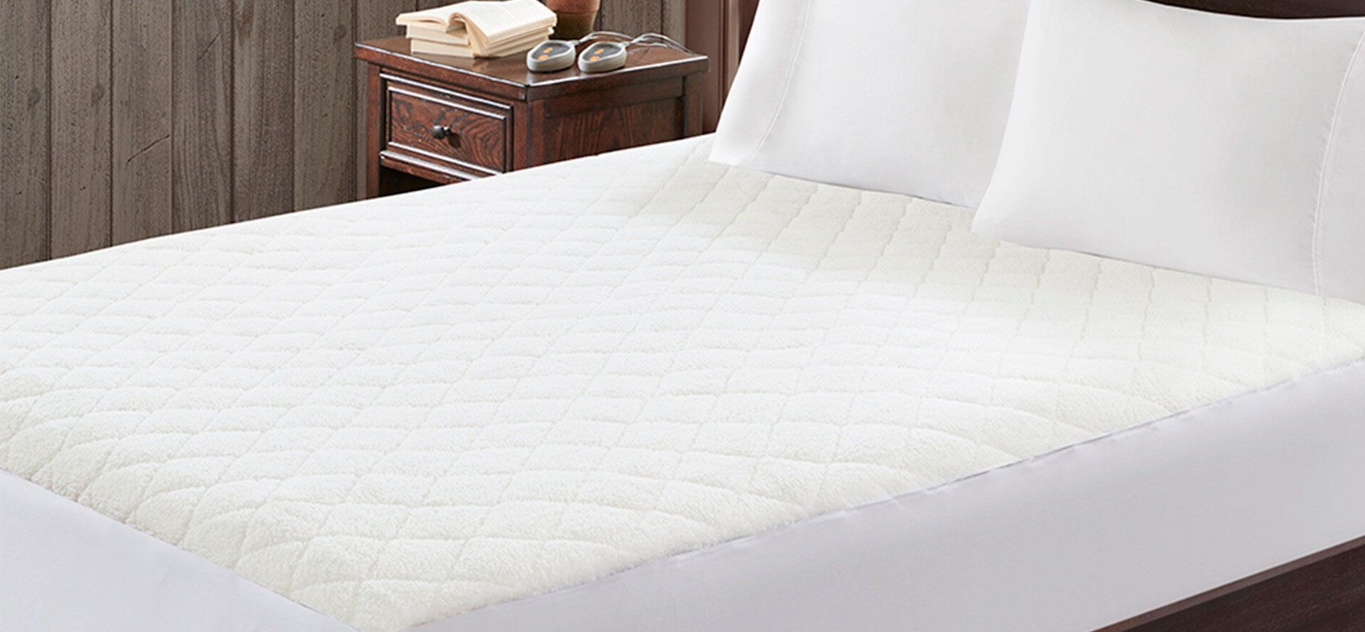 Heated mattress pad on the bed.