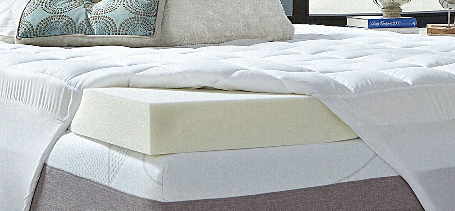 Memory foam mattress topper on the mattress.