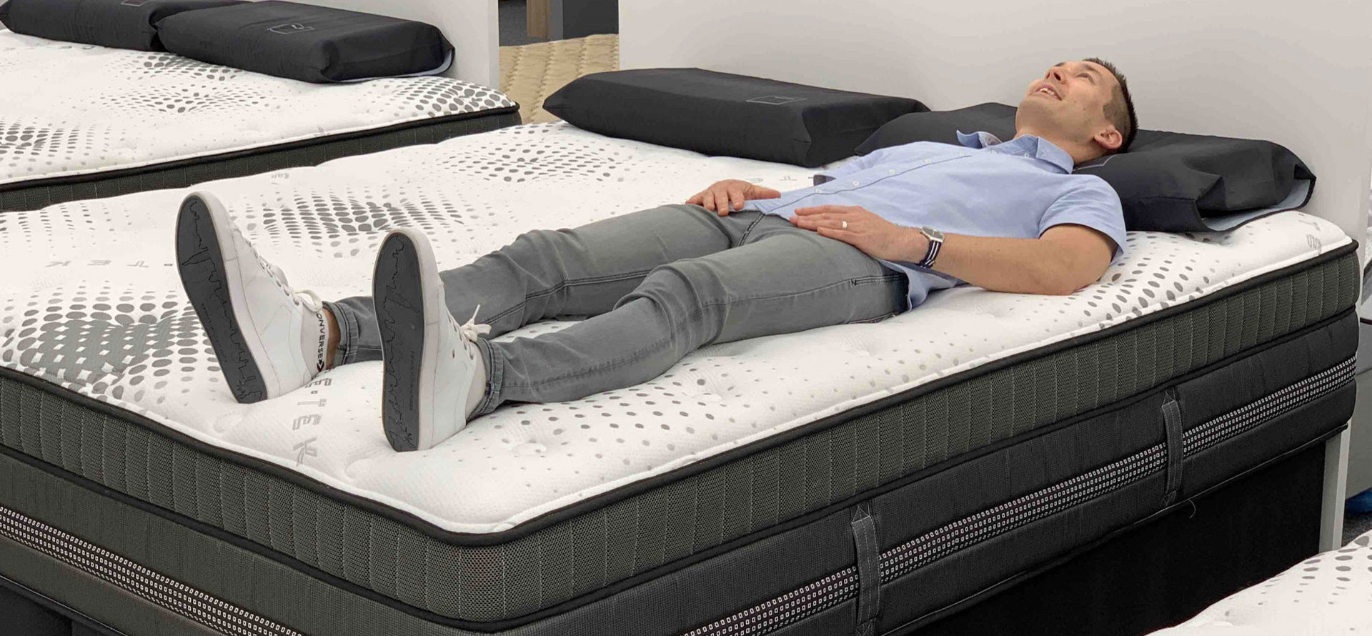 A man sleeping on mattress.