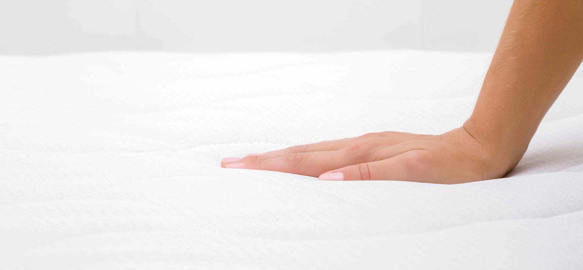 Plush mattress with hand.
