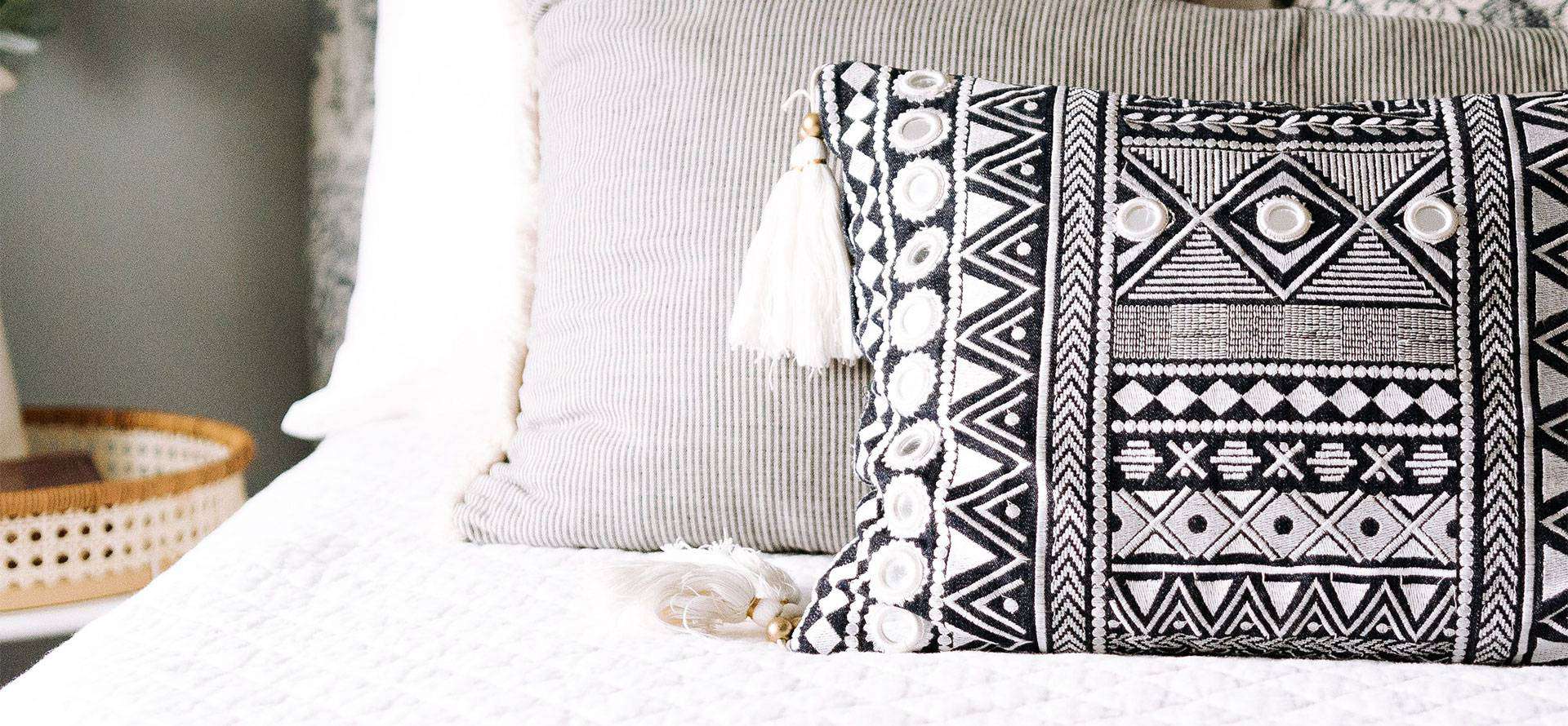 Throw pillows on the bed.
