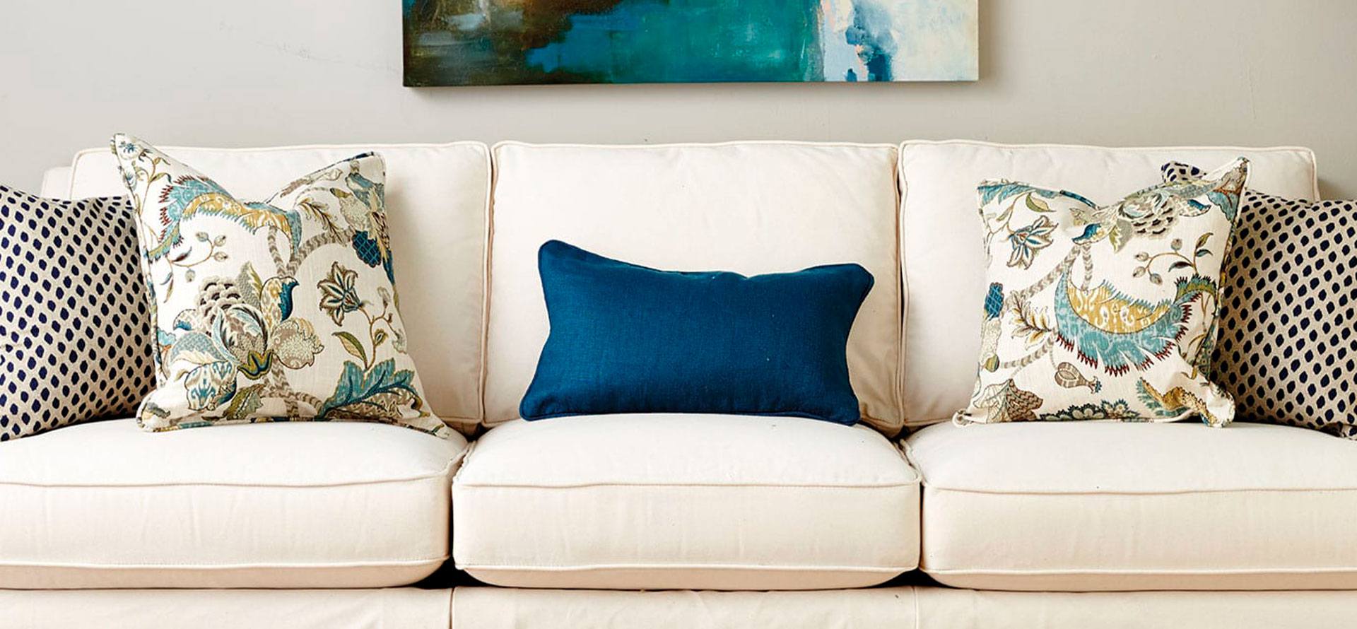 Throw pillows on couch in the room.