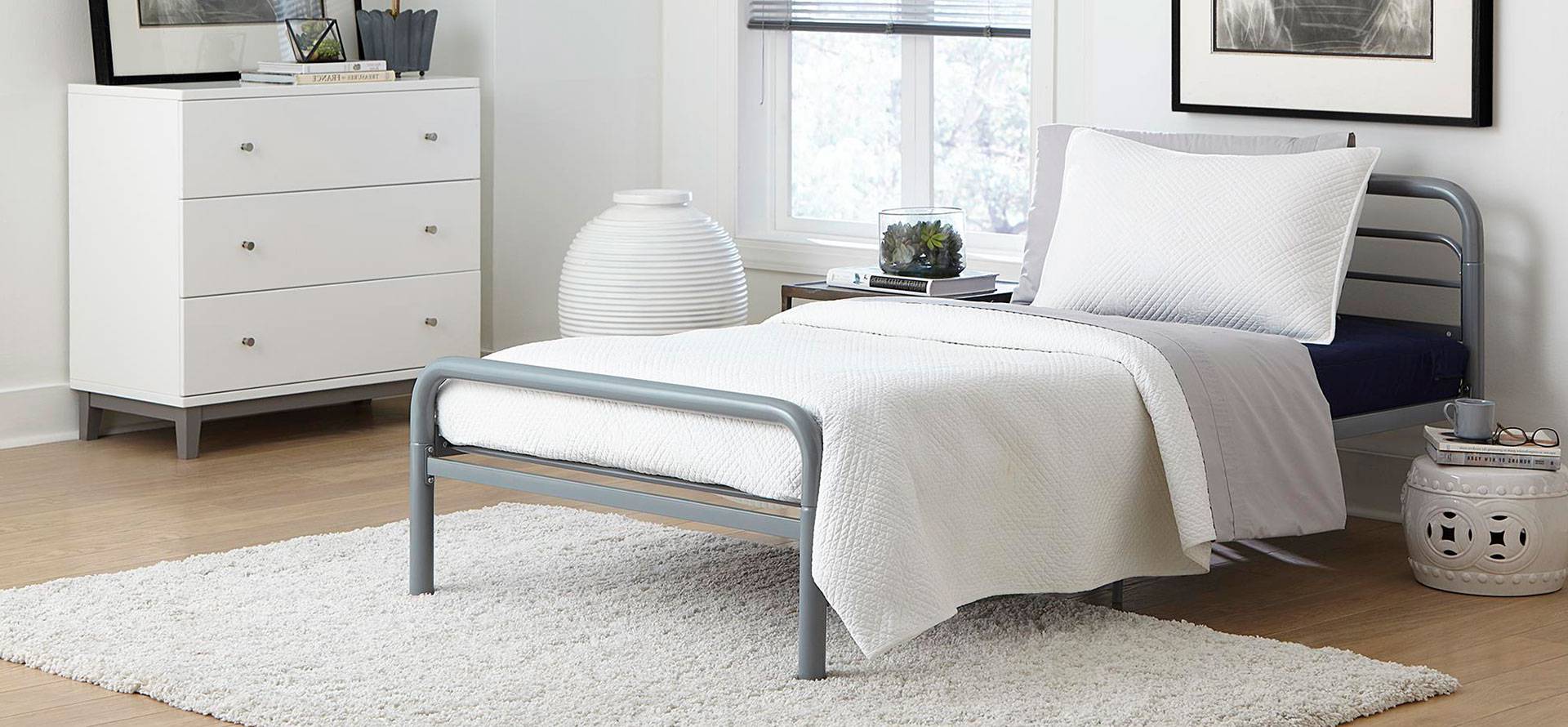 Twin size mattress on the bed frame.
